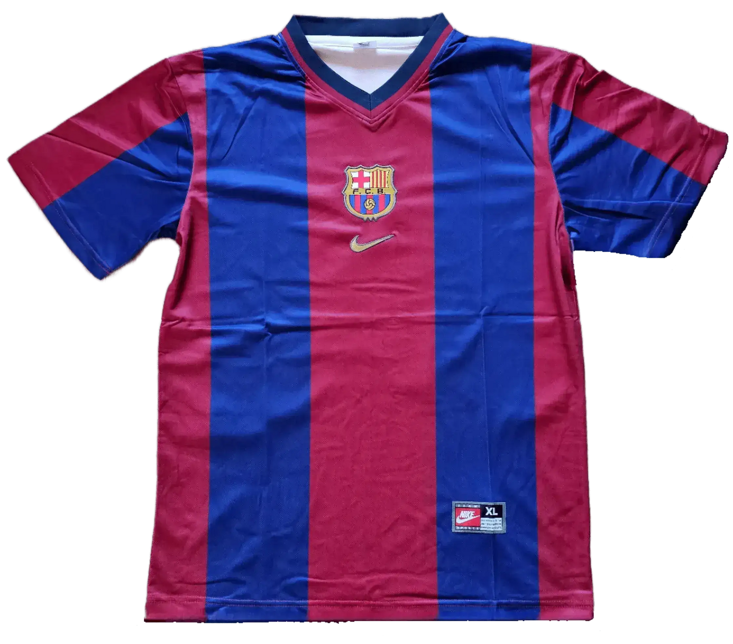 Front view featuring FC Barcelona crest and Nike logo on red and blue striped soccer jersey.