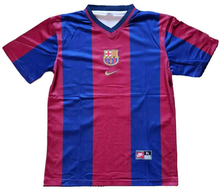 Front view featuring FC Barcelona crest and Nike logo on red and blue striped football shirt.