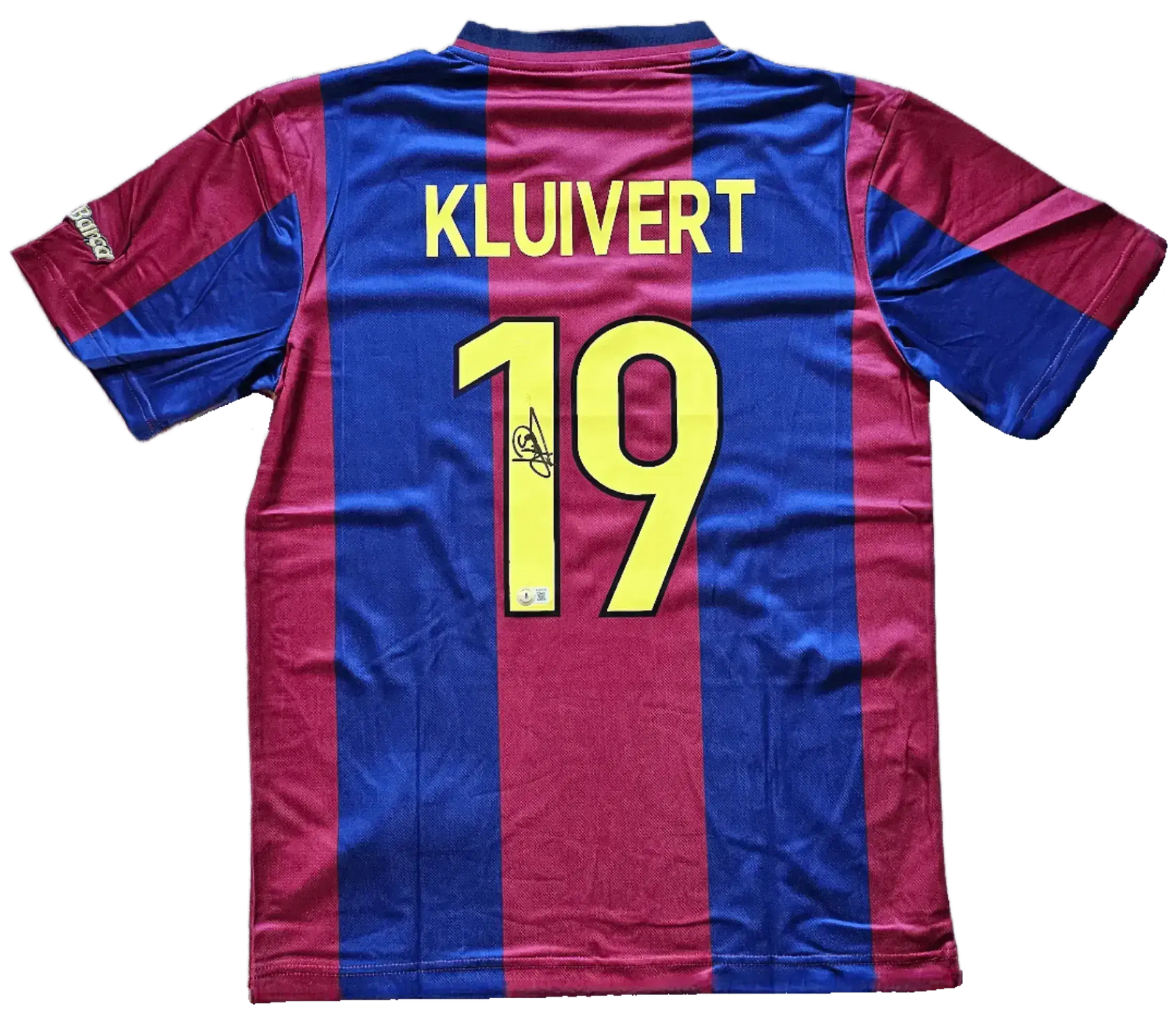 Back view showing Kluivert name, No. 19, and signature detail on Barcelona soccer jersey.