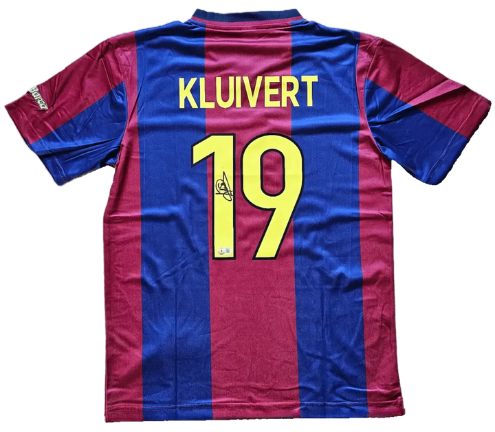 Back view showing Kluivert name, No. 19, and signature detail on Barcelona football shirt.