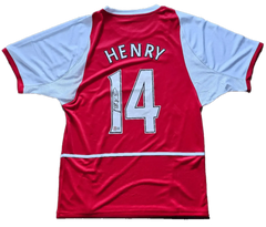 Back view showing No. 14, Henry, and a visible signature on the red soccer jersey.