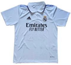 Front view of Real Madrid CF soccer jersey with 'Emirates FLY BETTER' and crest detail.