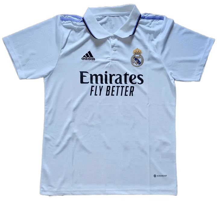 Front view of Real Madrid CF football shirt with 'Emirates FLY BETTER' and crest detail.