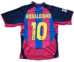 Back view showing Ronaldinho, No. 10, and signature on FC Barcelona shirt.