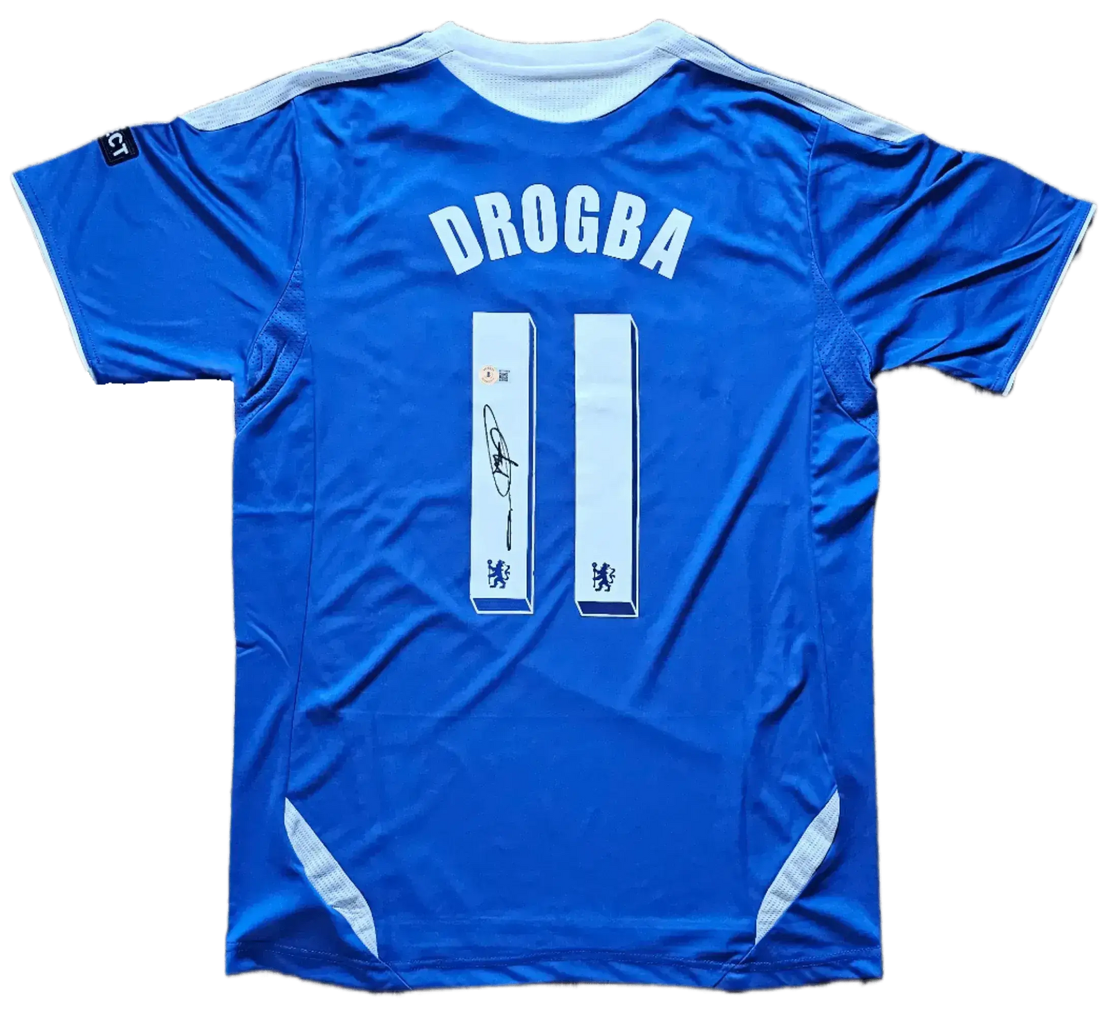 Back view featuring DROGBA, No. 11, and a signature on a blue soccer jersey.