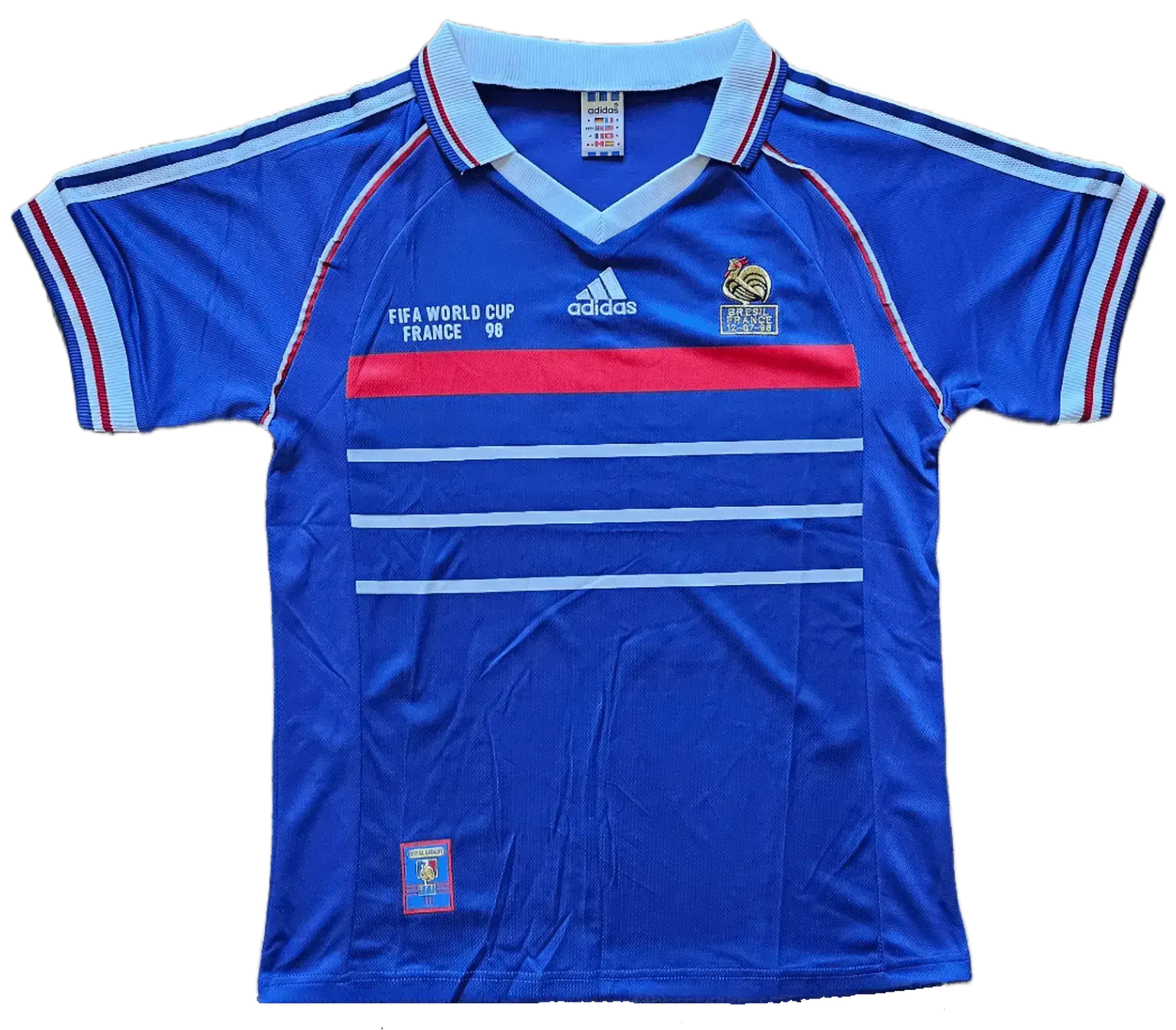 Front view of a signed Robert Pires France 1998 World Cup soccer jersey featuring blue, red, and white colors.