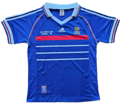 Front view of a signed Robert Pires France 1998 World Cup soccer jersey featuring blue, red, and white colors.
