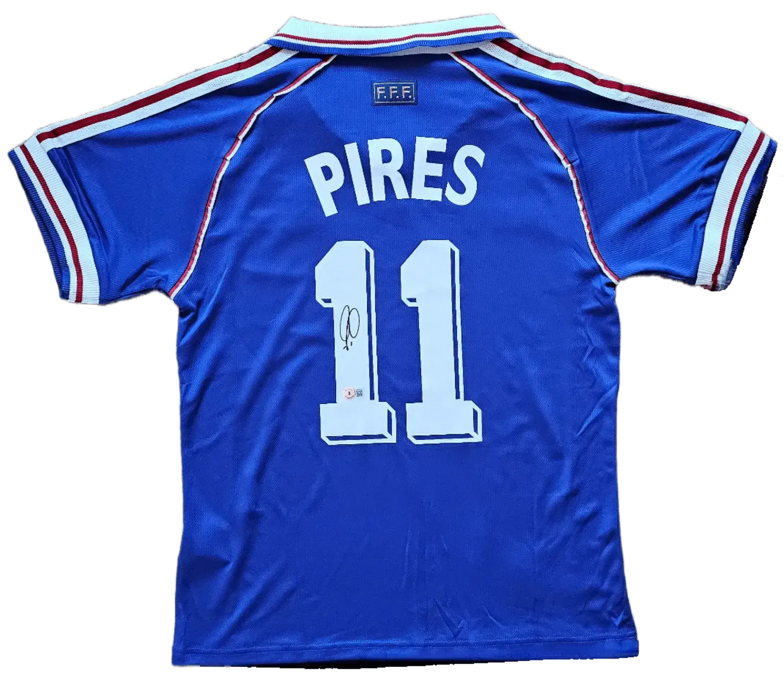 Back view featuring Pires, No. 11, and a visible signature detail on the soccer jersey.