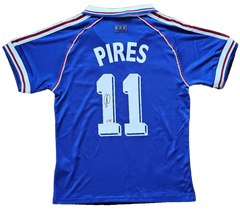 Back view featuring Pires, No. 11, and a visible signature detail on the soccer jersey.
