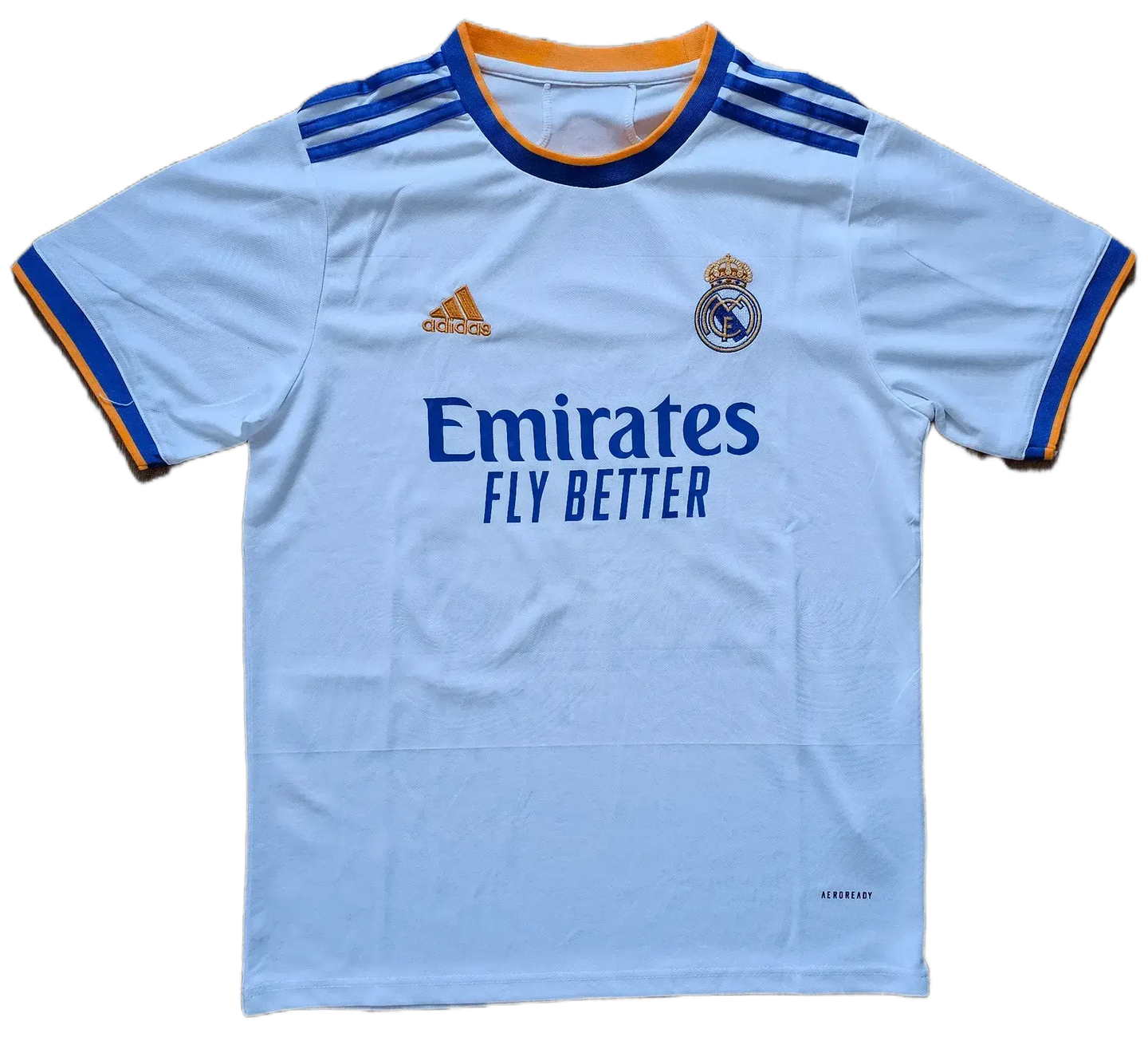 Front view showing Real Madrid crest, 'Emirates FLY BETTER' sponsor, and adidas logo.