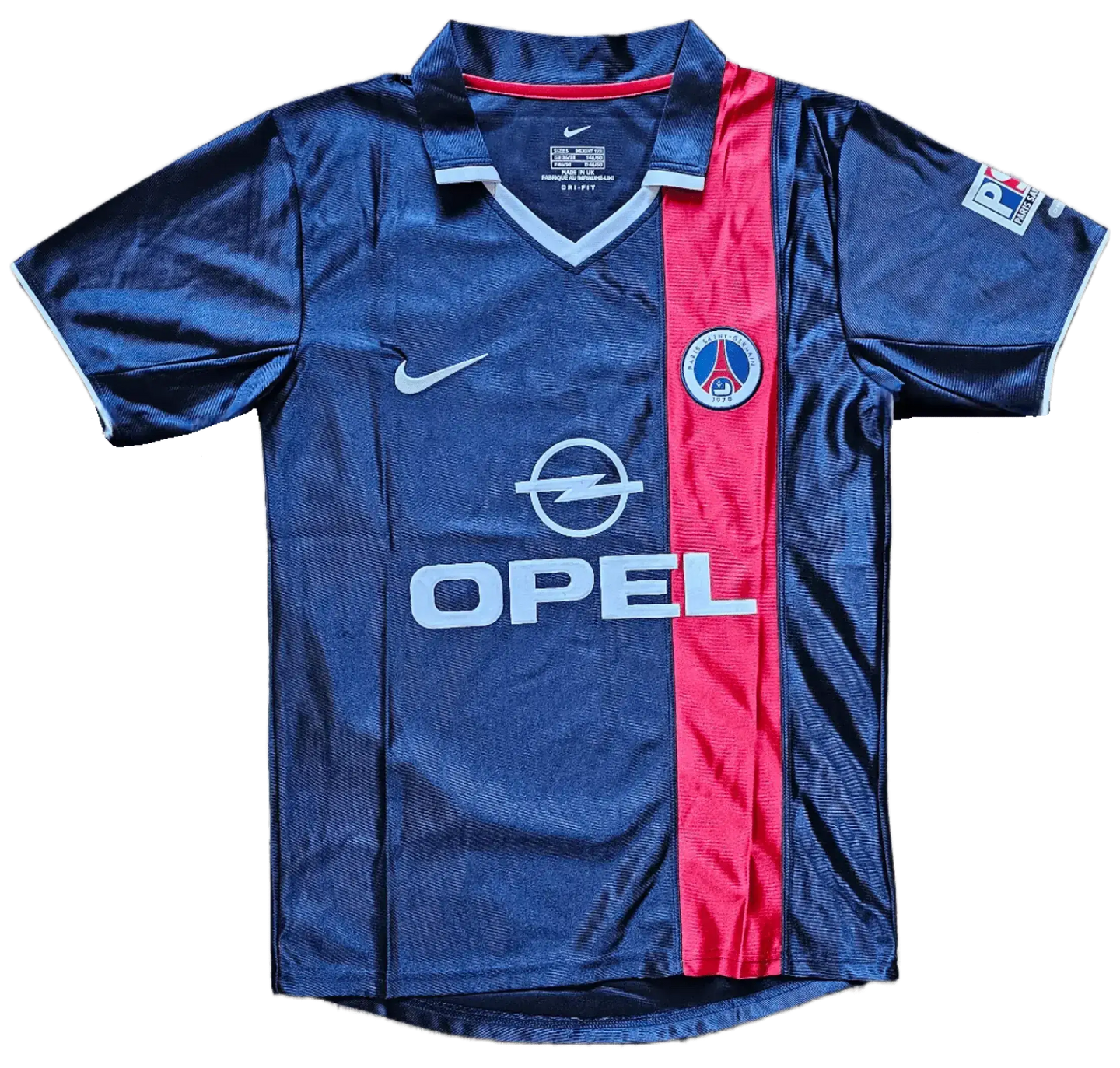 Front view of a signed Ronaldinho 10 Paris Saint-Germain soccer jersey with blue and red colors and crest.