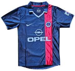 Front view of a signed Ronaldinho 10 Paris Saint-Germain soccer jersey with blue and red colors and crest.
