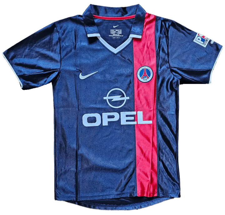 Front view of a signed Ronaldinho 10 Paris Saint-Germain soccer jersey with blue and red colors and crest.