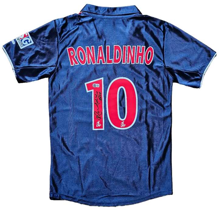 Back view showing Ronaldinho, No. 10 and signature on a blue and red soccer jersey.