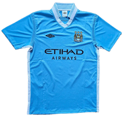 Front view featuring blue Manchester City F.C. soccer jersey with ETIHAD AIRWAYS and three stars.