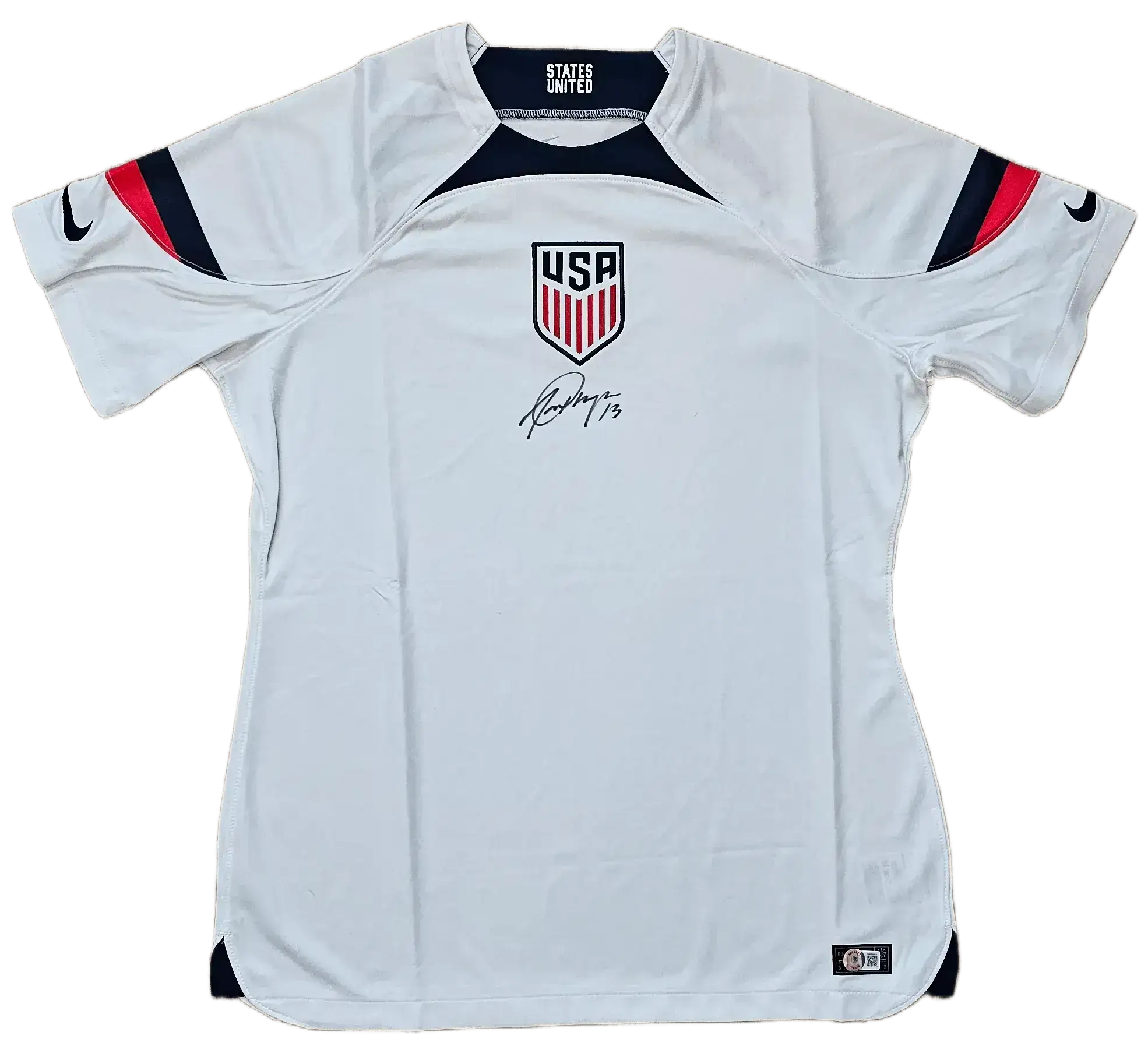 Front view of USA soccer jersey featuring crest, player name USA, and signature by Morgan.