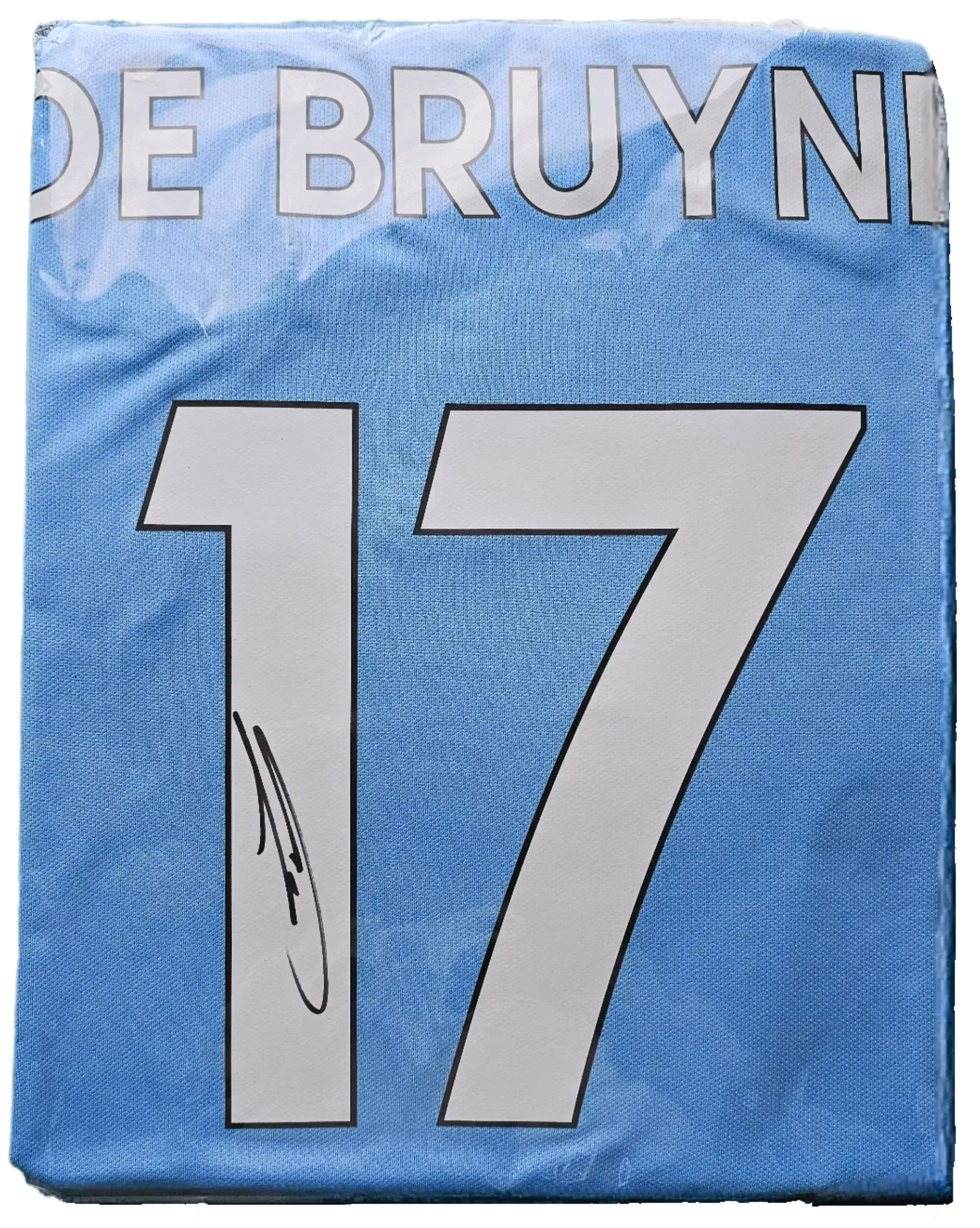Back view showing De Bruyne, No. 17, and a visible signature.