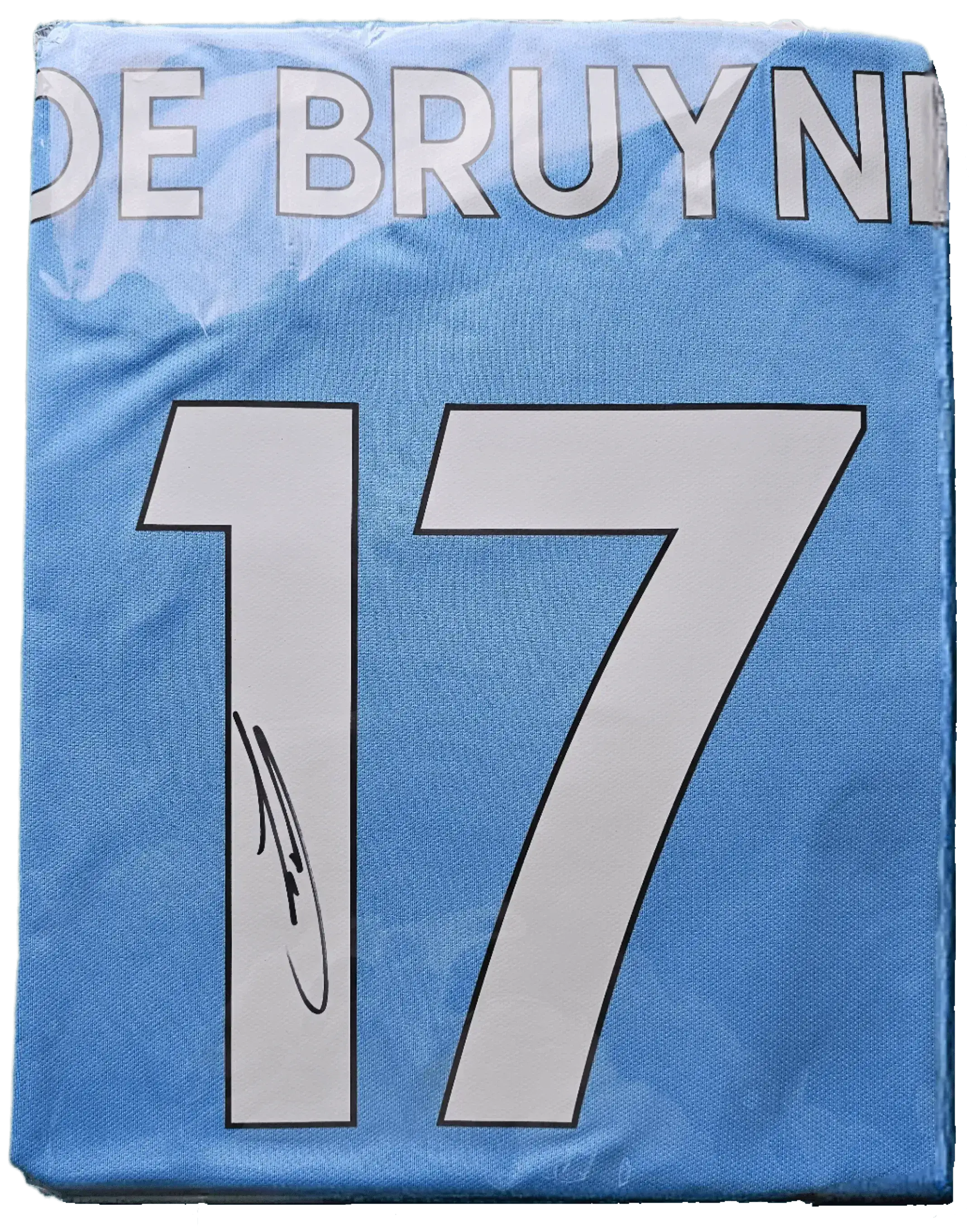 Back view showing De Bruyne, No. 17, and a visible signature.