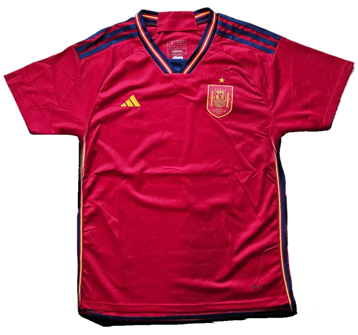 Front view of a red football shirt featuring the Spain crest, adidas logo, and one star.