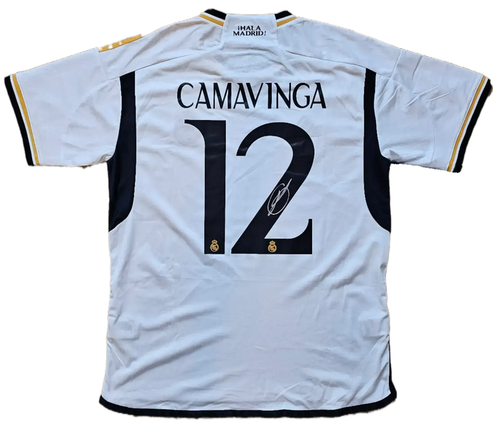 Back view featuring No. 12, Camavinga, and his signature on a white football shirt.