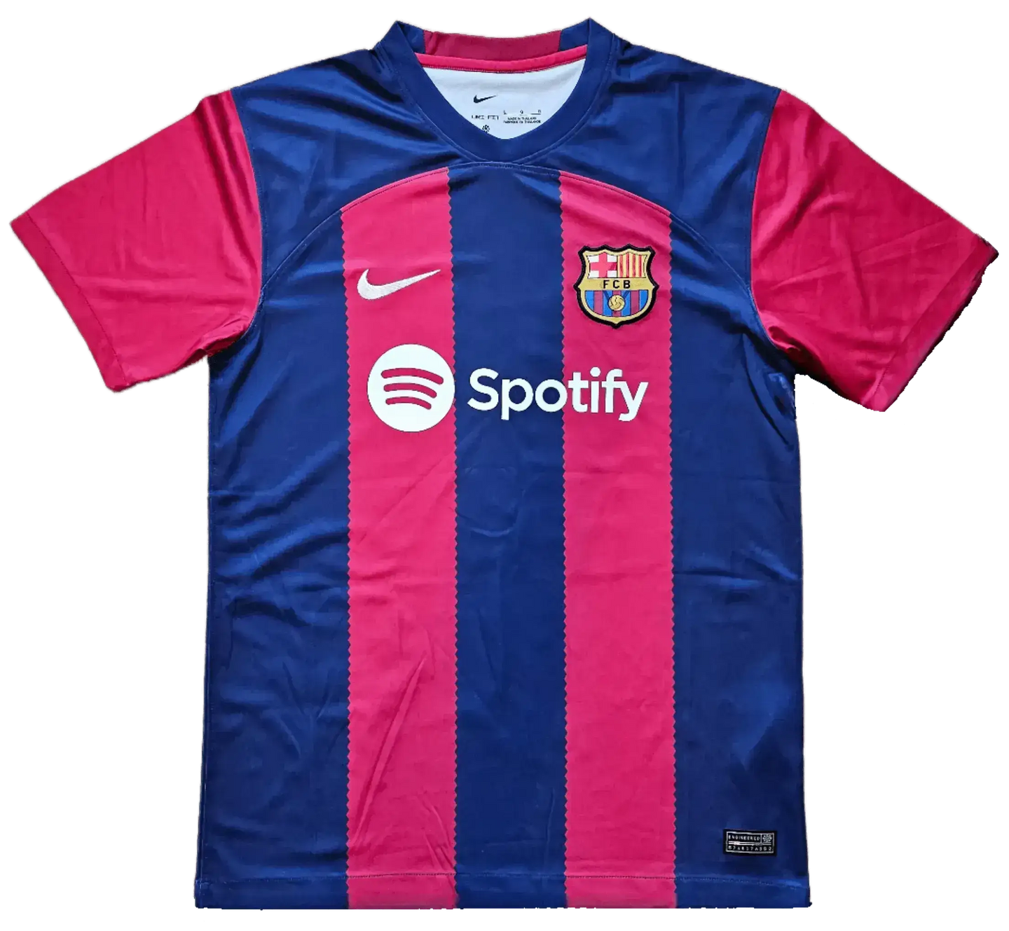 Front view of FC Barcelona soccer jersey in red and blue with Spotify logo and Nike swoosh.