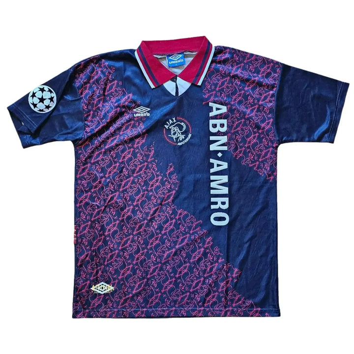 Front view showing ABN AMRO sponsor, Ajax crest, and Umbro logo on blue and maroon football shirt.