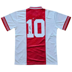 Back view showing No. 10 and signature on a red and white football shirt.