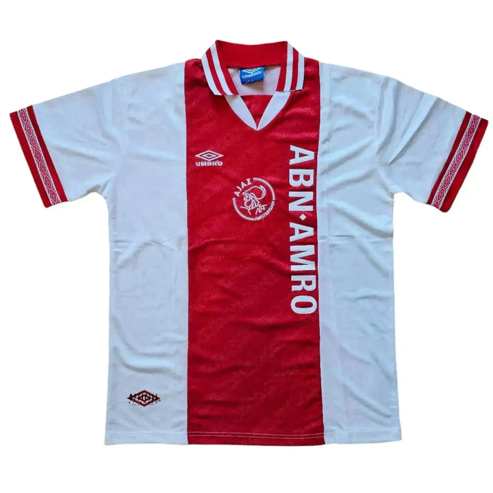 Front view of signed football shirt featuring Ajax crest, ABN AMRO sponsor, and red and white colors.