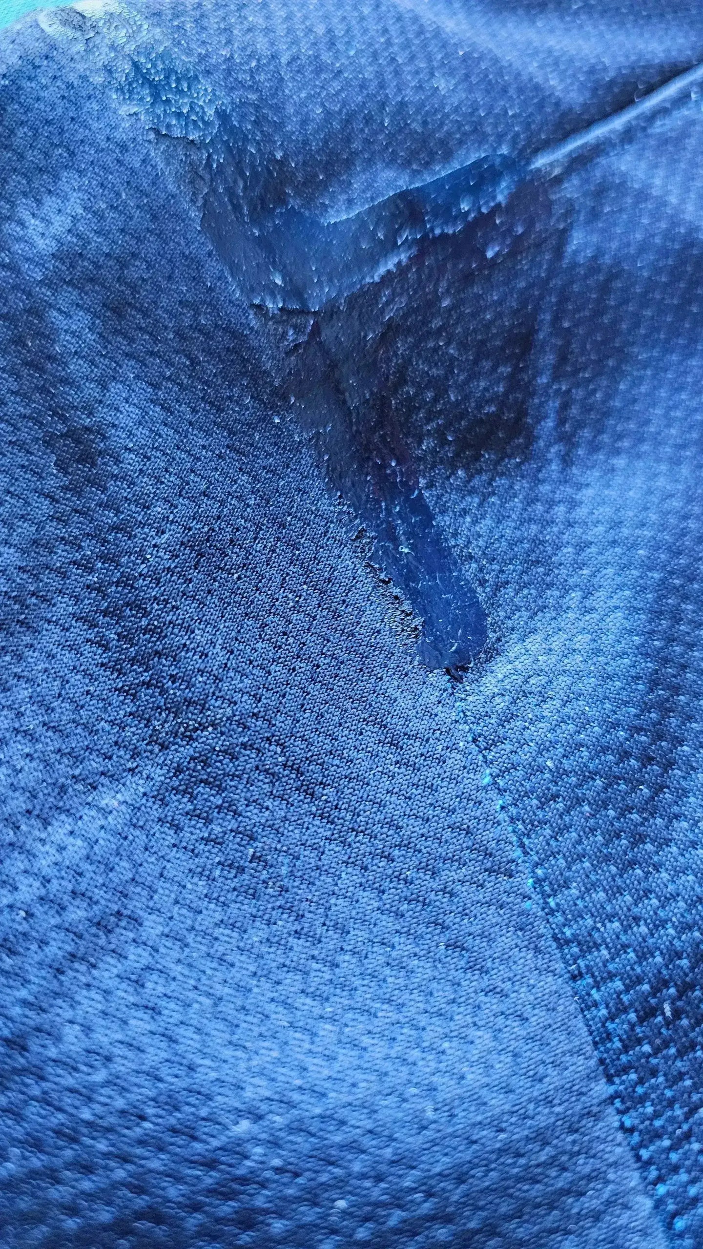 Detail view of the fabric showcasing texture and imperfections of the soccer jersey.