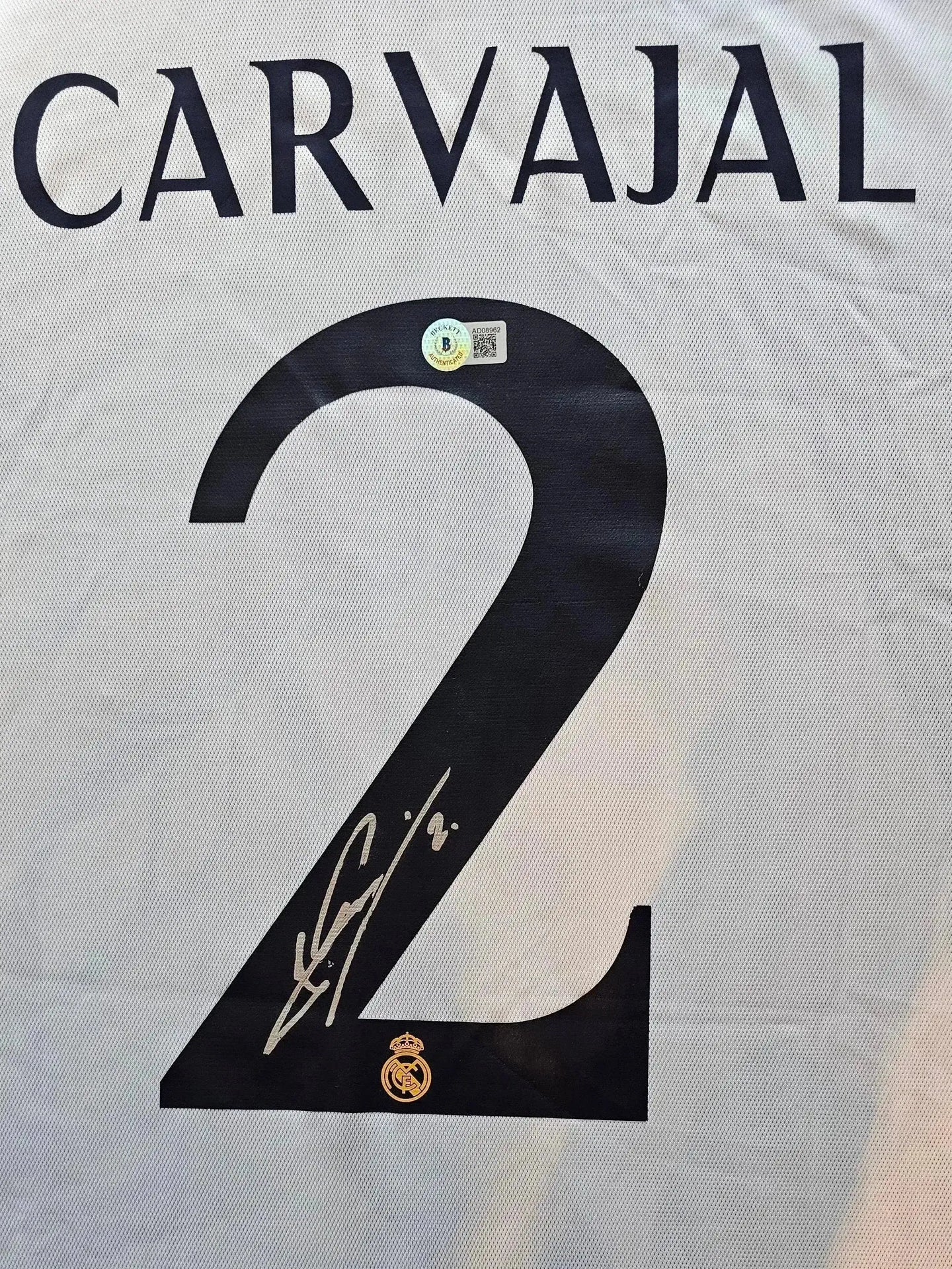 Back view showing Carvajal's name, No. 2, and a signature, featuring Real Madrid crest.