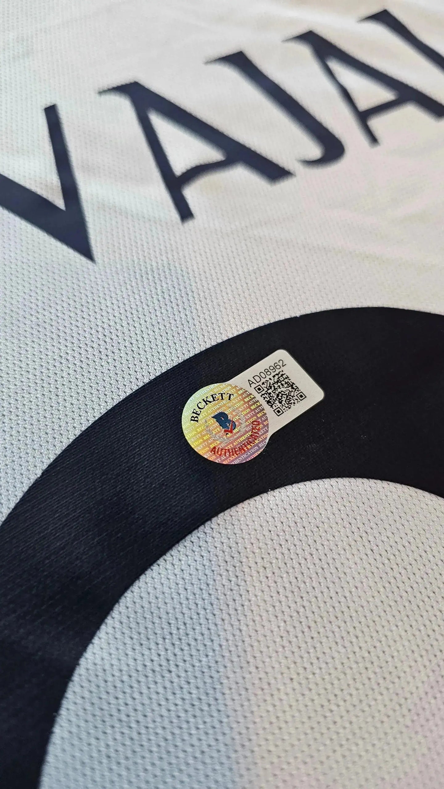 Close-up of Beckett authentication sticker on Dani Carvajal signed football shirt with V914 on back.