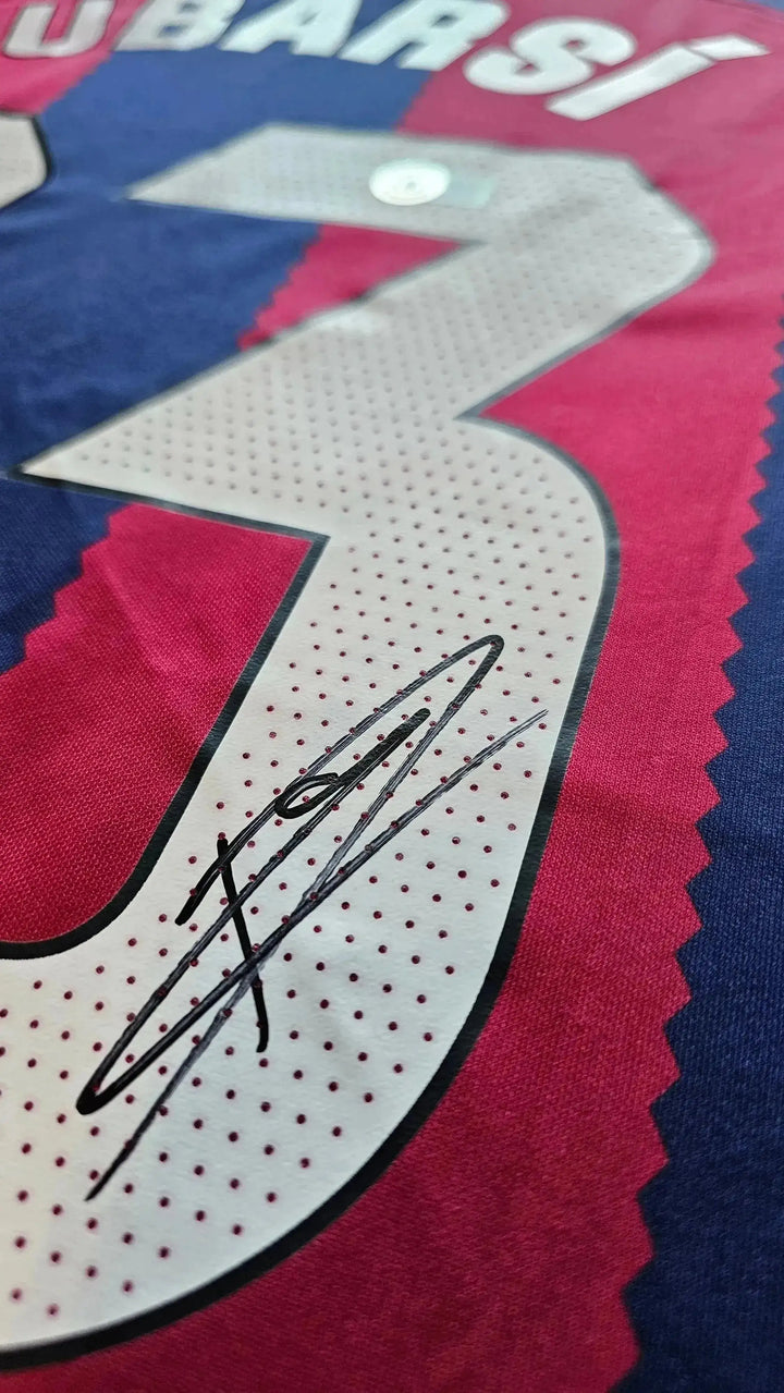Close-up of No. 33 on shirt, featuring Pau Cubarsí's signature below the number.