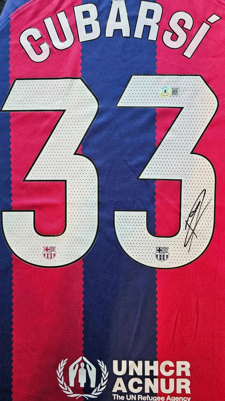 Back view showing No. 33, name Cubarsí, and a visible signature.