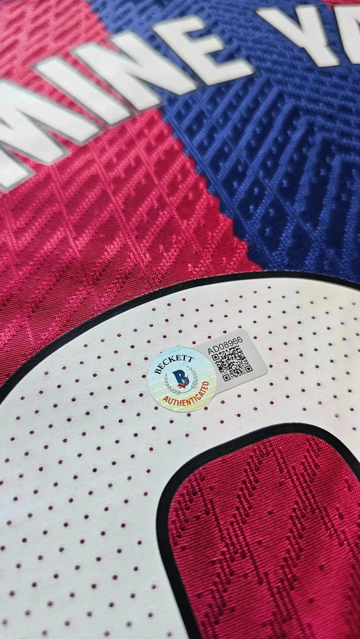 Close-up of Beckett authentication sticker featuring B and text &