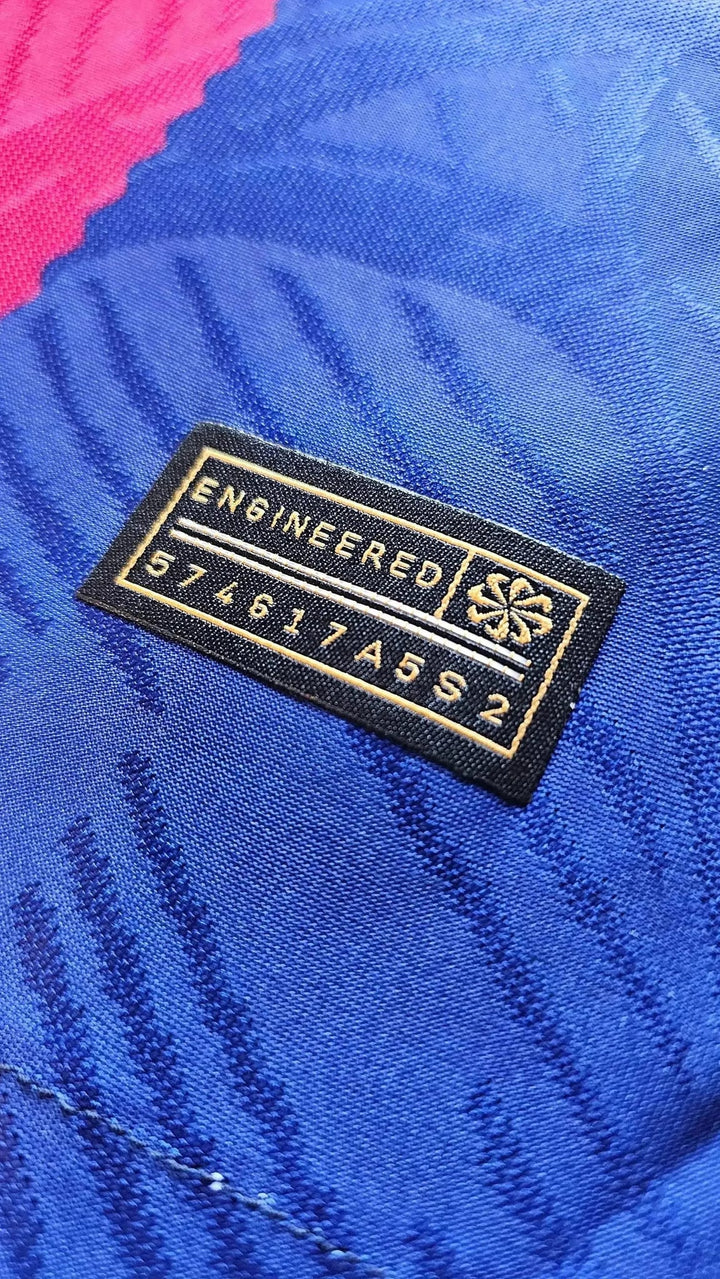 Close-up of the black and gold Nike ENGINEERED label coded 574617A5S2 on the Lamine Yamal FC Barcelona 2023-24 home shirt.