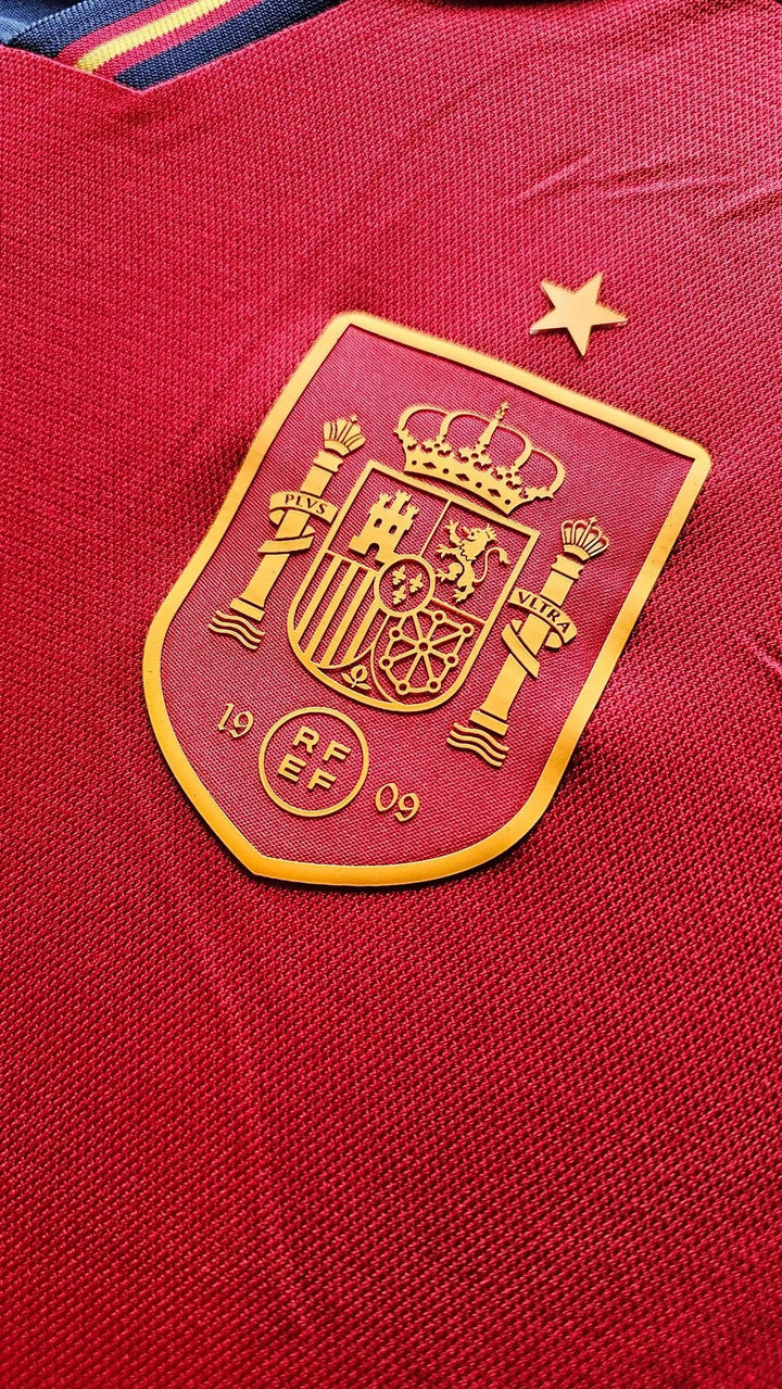 Crest detail showing the golden Spain national team badge with one star and RF EF text.
