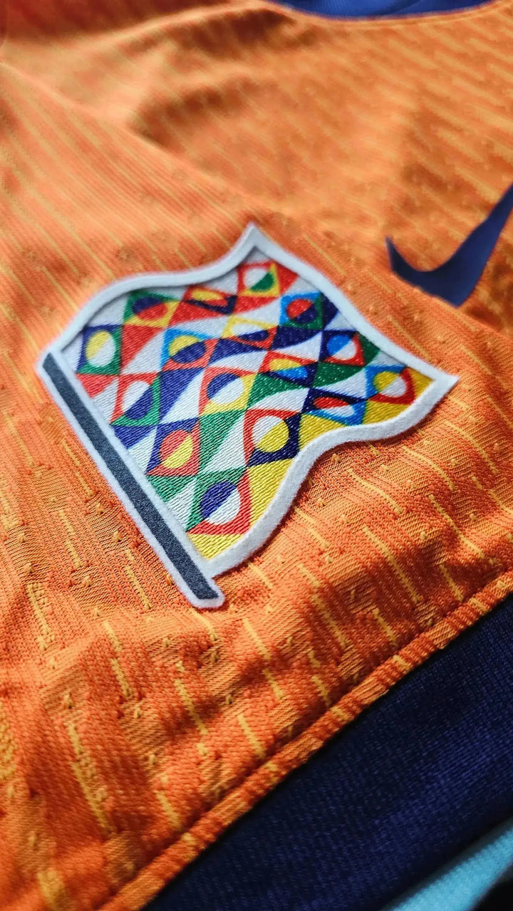 Detailed view of the colorful crest on the Jorrel Hato Holland signed football shirt.