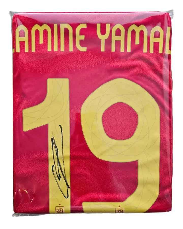 Back view showing Lamine Yamal, No. 19, and a visible signature on a red football shirt.