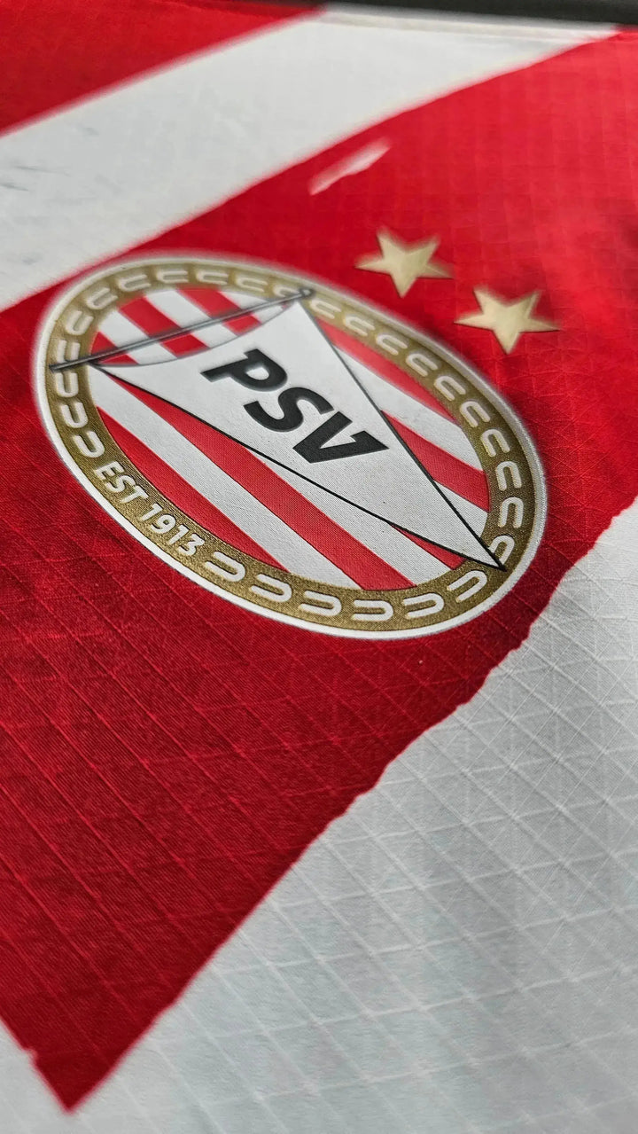 Close-up of PSV Eindhoven crest with two stars and &