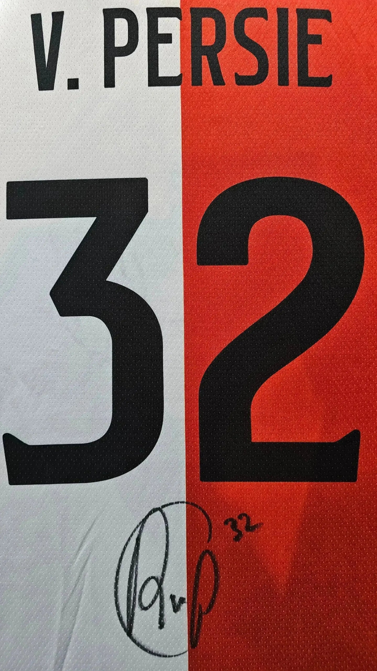 Signature detail of Robin van Persie with No. 32 on signed football shirt.