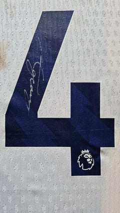 Signature detail showing No. 14 and signature on the back of the football shirt.