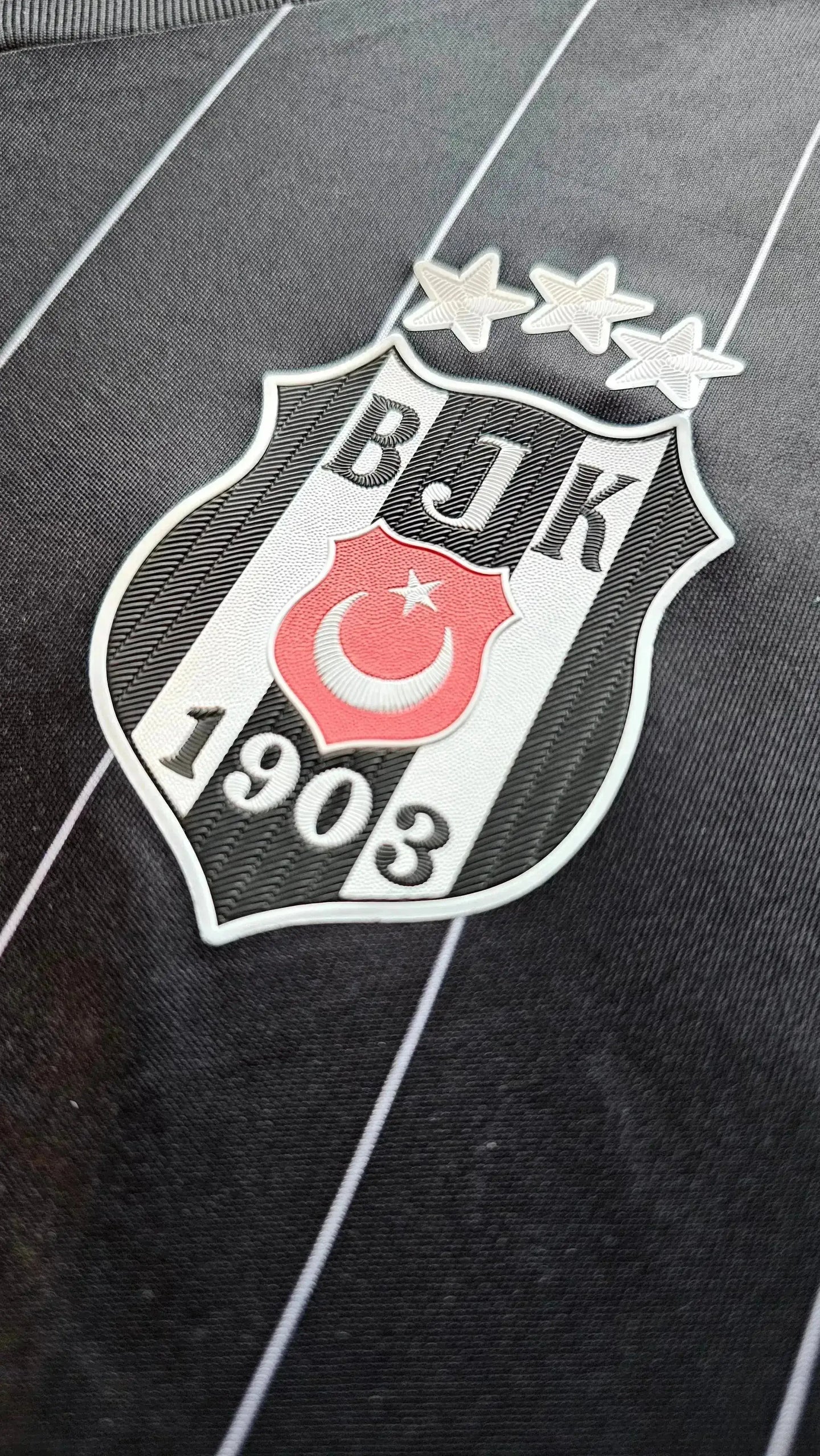 Crest detail featuring Beşiktaş J.K. logo with three stars and the founding year 1903.