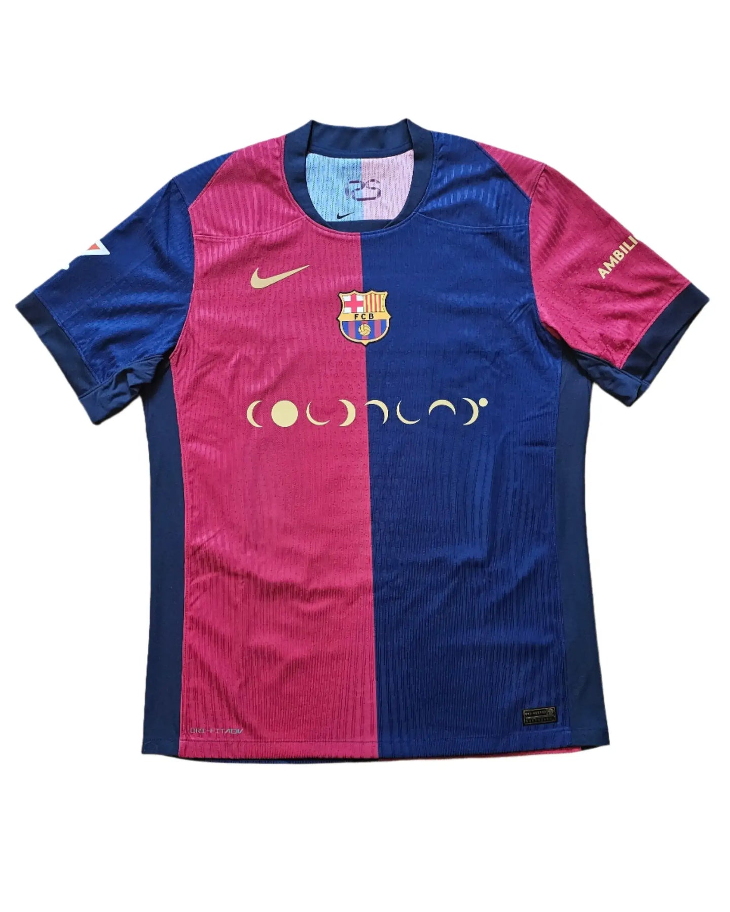 Front view of Barcelona football shirt featuring crest and Nike logo in blue and red.