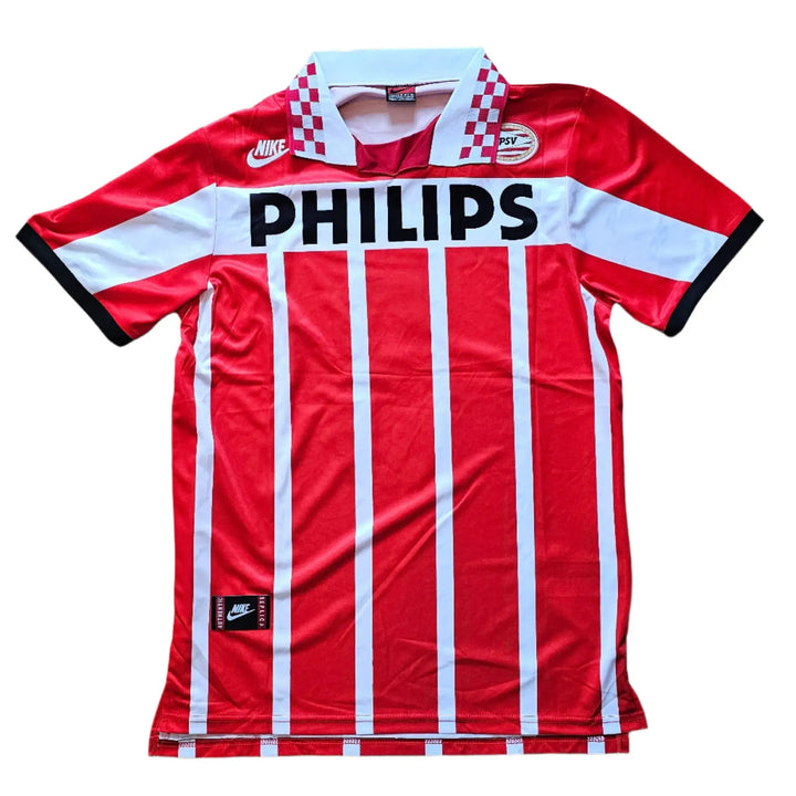 Front view of a signed PSV Eindhoven football shirt featuring &