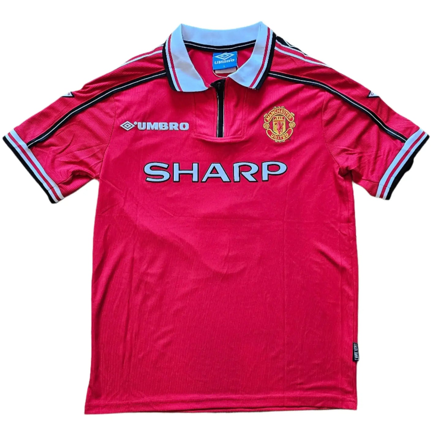 Front view showing Manchester United crest, SHARP sponsor, and Umbro branding on a red soccer jersey.