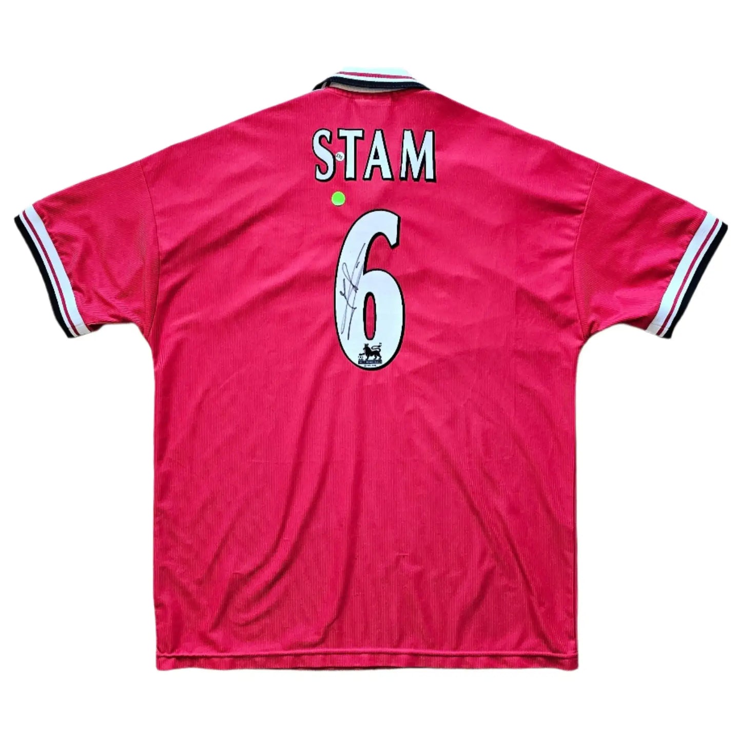 Back view displaying No. 6 and STAM, featuring a visible signature on the football shirt.