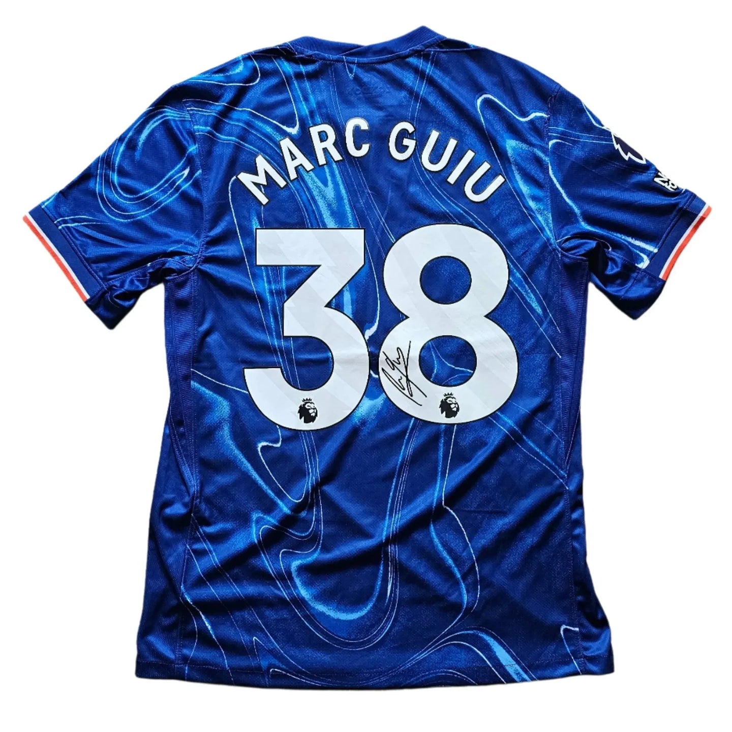 Back view showing name 'MARC GUIU', No. 38, and a visible signature.