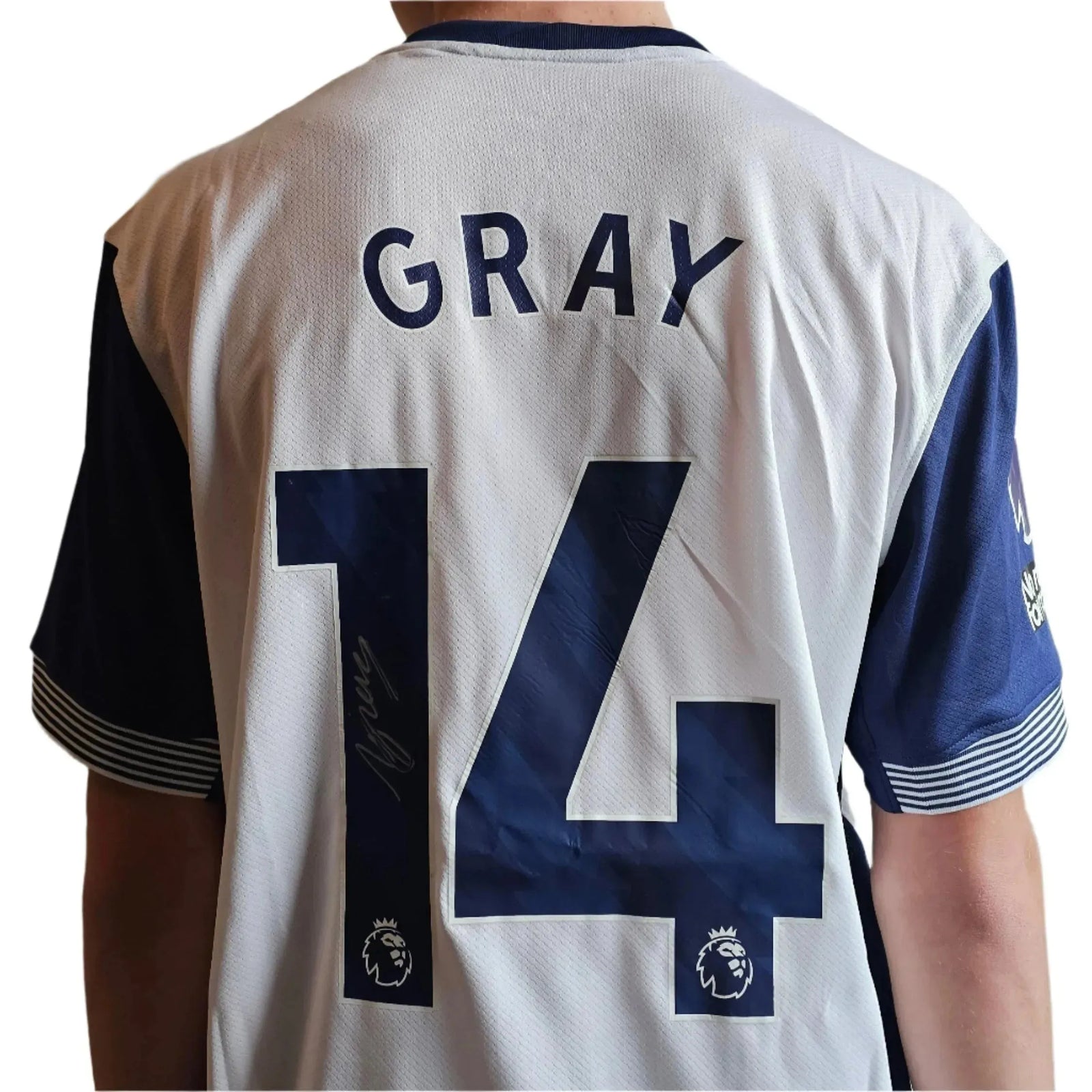 Back view showing No. 14, name Gray, with signature visible on the shirt.