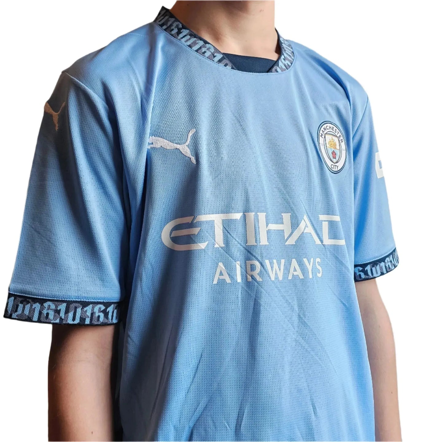 Front view of a signed Savinho 26 Manchester City football shirt featuring the Etihad Airways logo.