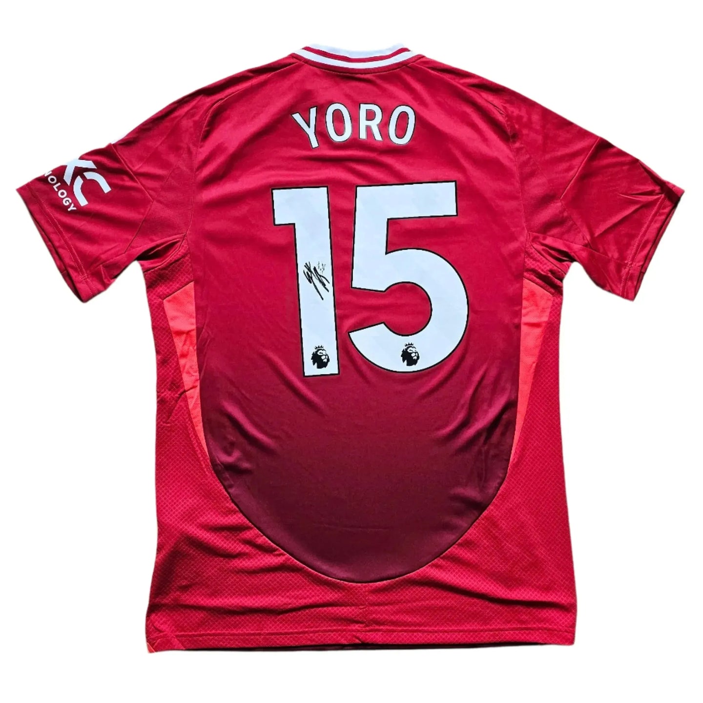 Back view showing Yoro, No. 15, and visible signature on a red football shirt.